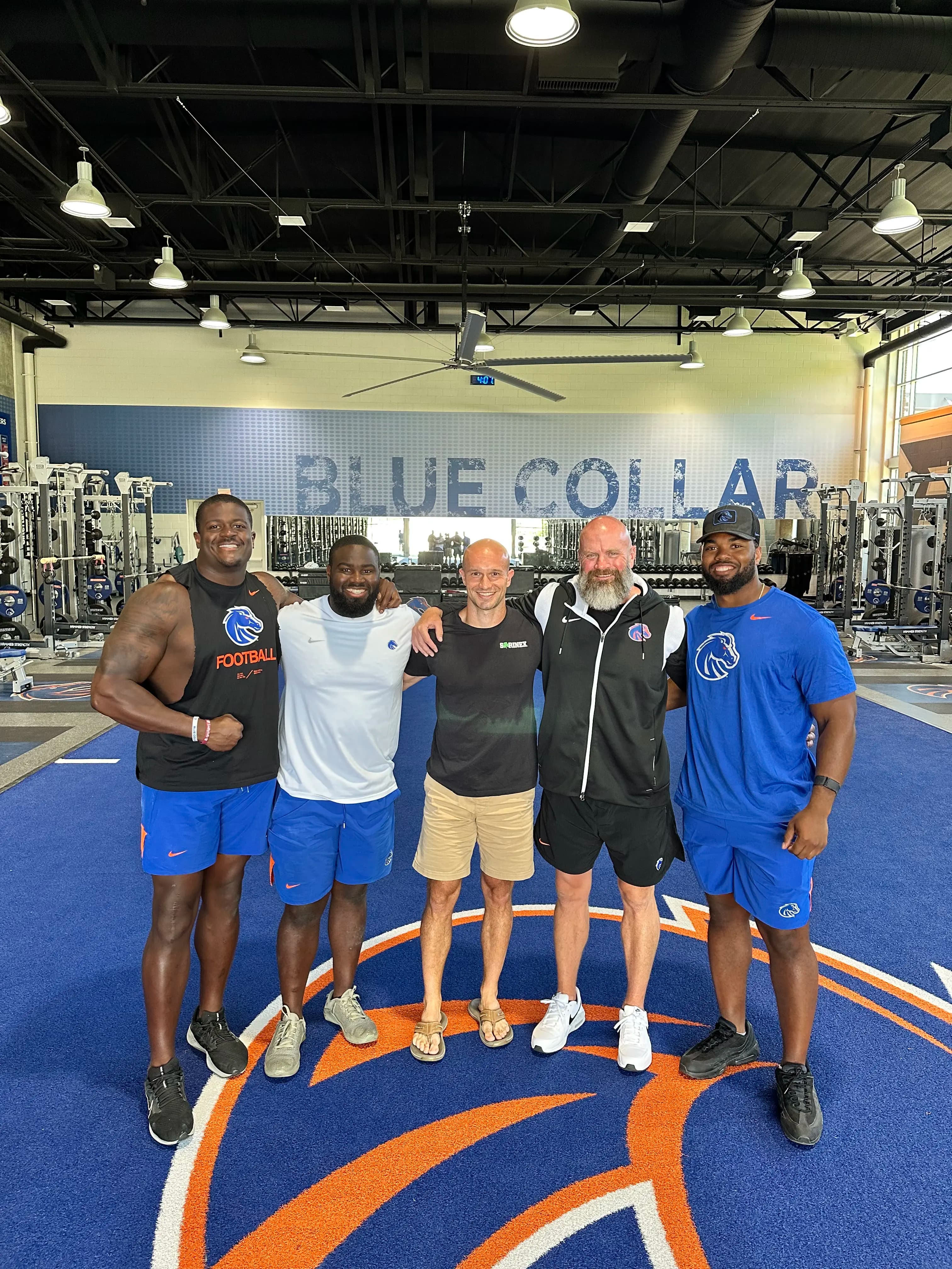 Dr. Marc Lewis with the Boise State football staff